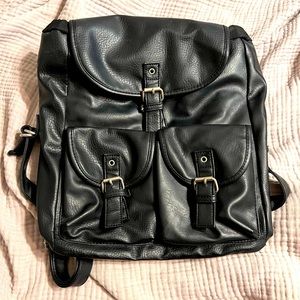 Black faux leather back pack